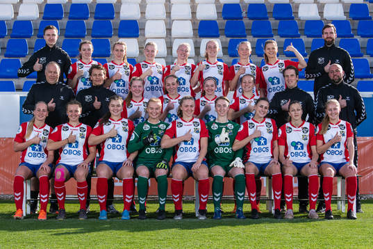 Lyn poses for a team photo