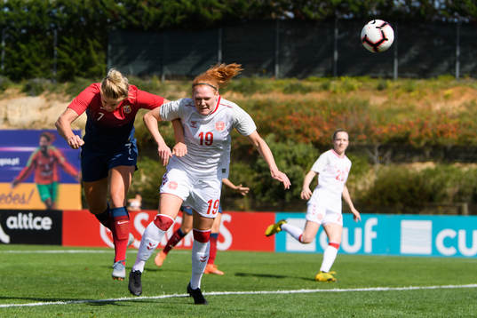 Elise Thorsnes of Norway scores 1-1 past defending Stine