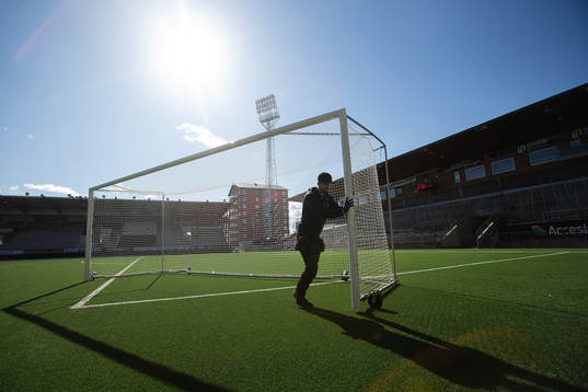 A caretaker is moving a goal at Behrn Arena as the