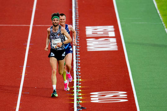 Sindre Buraas and Sondre Nordstad Moen of Norway compete in