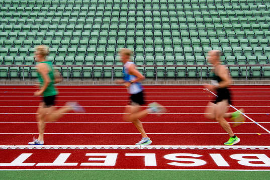 Empty seats in the stands as athletes compete in the