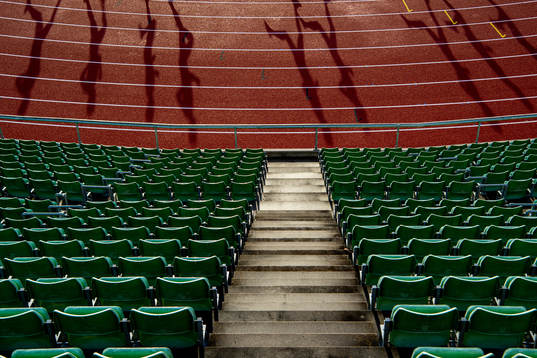 Empty seats in the stands as athletes compete in the