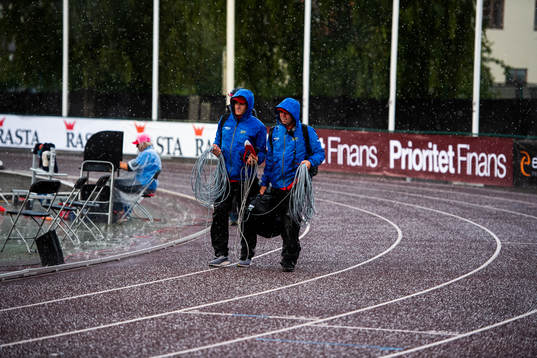 Officials walks through the hail