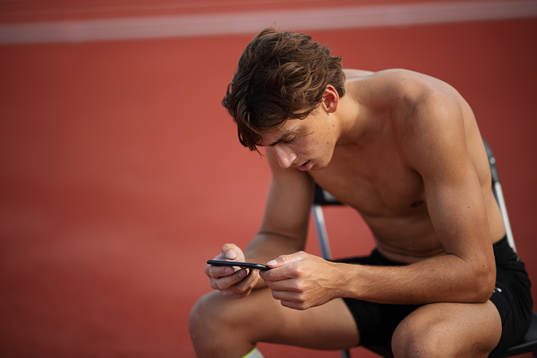Swedish pole vaulter Armand Duplantis looks at video of a