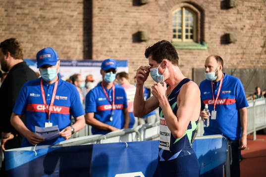 Jakob Ingebrigtsen of Norway with a face mask due to the
