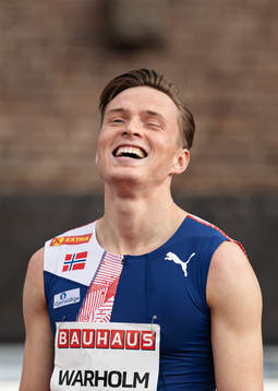 Karsten Warholm of Norway celebrates