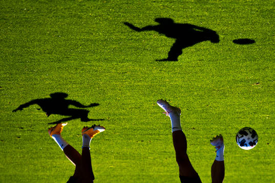 The shadows of Erling Braut Haaland and Tore Reginiussen of