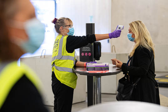 Journalist Jane Björck of SVT has her temperature checked