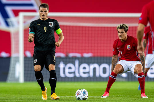 Marcel Sabitzer of Austria and Mathias Normann of Norway