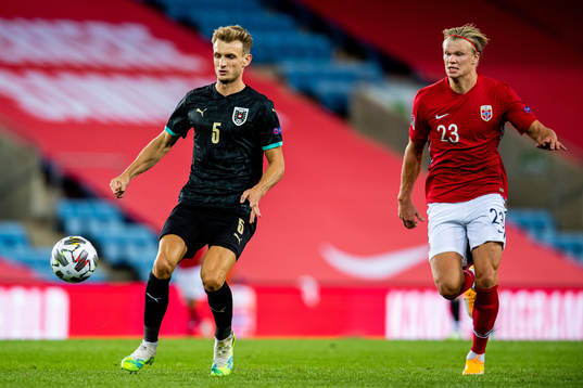 Stefan Posch of Austria and Erling Braut Haaland of Norway