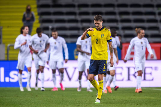 Mikael Lustig of Sweden looks dejected