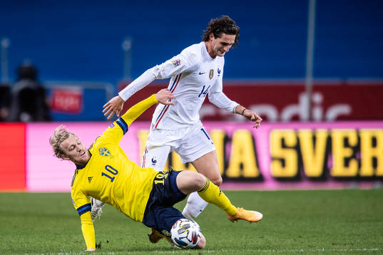 Emil Forsberg of Sweden and Adrien Rabiot of France