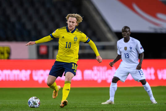 Emil Forsberg of Sweden and N'Golo Kanté of France