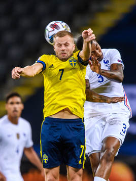 Sebastian Larsson of Sweden and Presnel Kimpembe of France