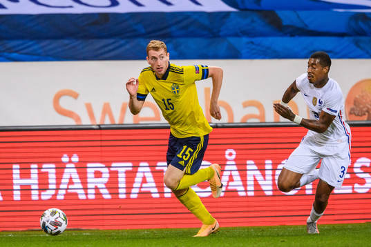Dejan Kulusevski of Sweden and Presnel Kimpembe of France