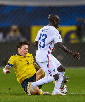 Victor Nilsson Lindelöf of Sweden and N'Golo Kanté of