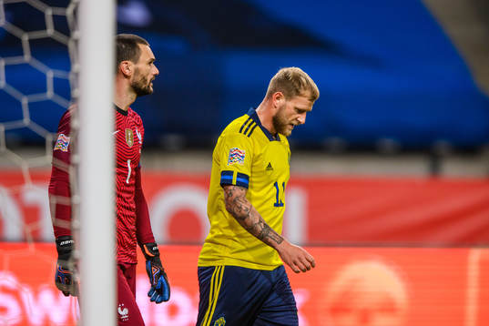 Goalkeeper Hugo Llorisof France and John Guidetti of Sweden
