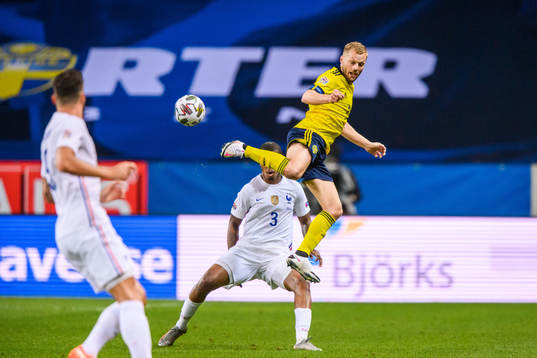 Presnel Kimpembe of France and Sebastian Larsson of Sweden