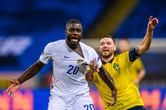 Dayot Upamecano of France and Marcus Berg of Sweden