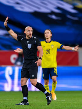 Referee Szymon Marciniak