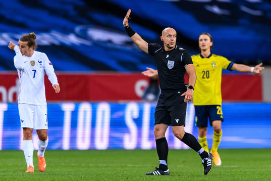 Referee Szymon Marciniak
