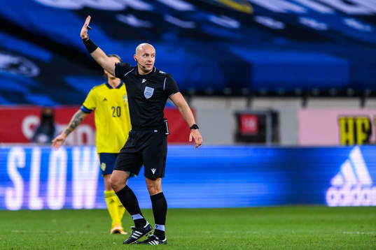 Referee Szymon Marciniak