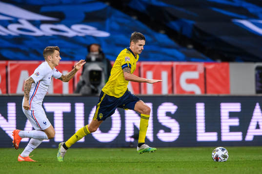 Lucas Digne of France and Mikael Lustig of Sweden