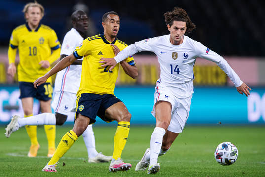 Robin Quaison of Sweden and Adrien Rabiot of France