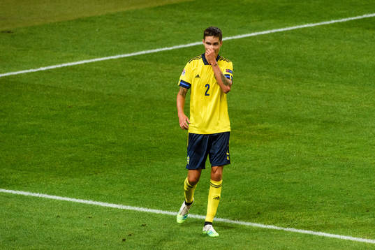 Mikael Lustig of Sweden looks dejected