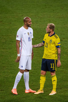 Steven Nzonzi of France and John Guidetti of Sweden
