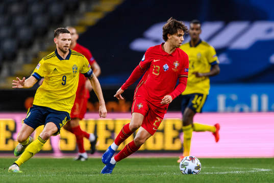 Marcus Berg of Sweden and Joao Felix of Portugal
