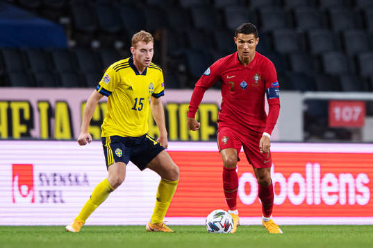 Dejan Kulusevski of Sweden and Cristiano Ronaldo of Portugal