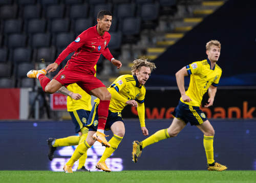 Cristiano Ronaldo of Portugal and Emil Forsberg of Sweden