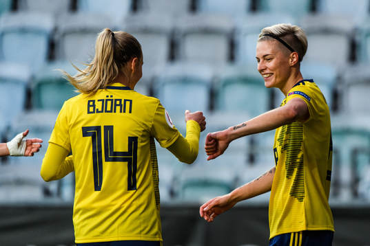Nathalie Björn and Lina Hurtig of Sweden celebrate the 1-0
