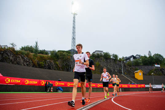 Tobias Lømo competes to win the men’s 5000 meter race