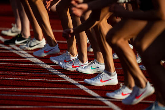 Athletes with Nike track shoes