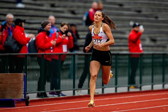 Amalie Iuel competes to win the women’s 400 meter hurdles