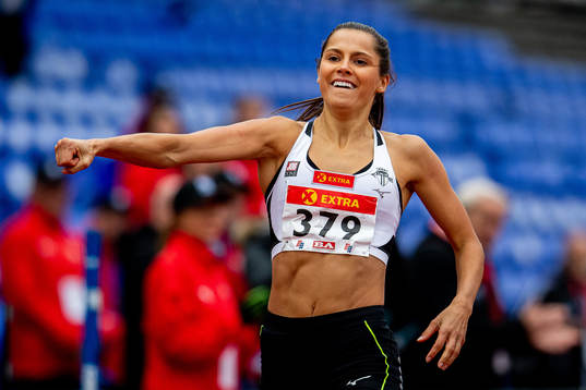 Amalie Iuel celebrates winning the women’s 400 meter