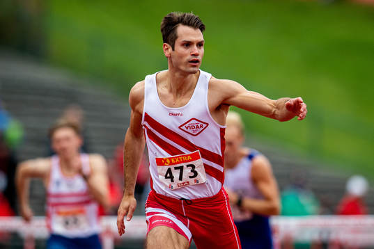 Vladimir Vukicevic competes to win the men’s 110 meter