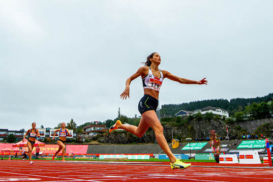 Amalie Iuel celebrates winning the women’s 400 meter