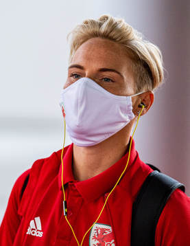 Jess Fishlock of Wales arrives wearing a face mask