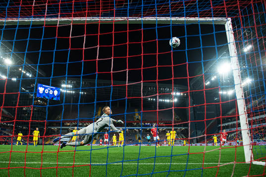 Goalkeeper Karl-Johan Johnsson of Sweden sees the ball hit