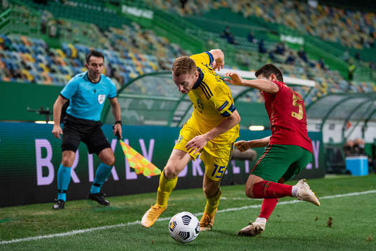 Dejan Kulusevski of Sweden and Raphael Guerreiro of Portugal