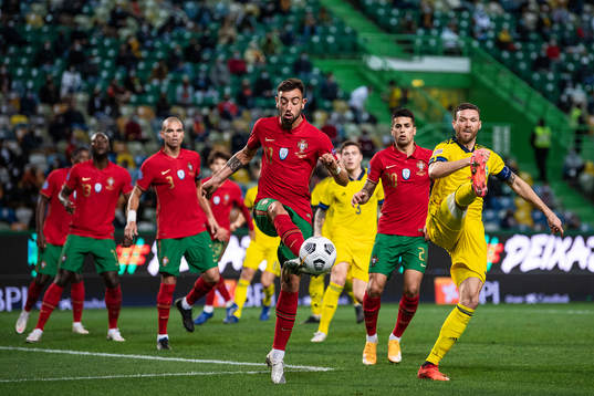 Bruno Fernandes of Portugal and Marcus Berg of Sweden