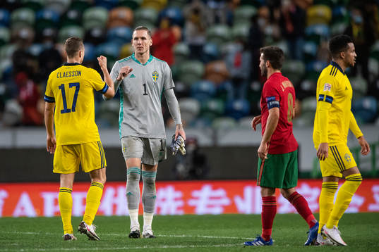 Viktor Claesson and goalkeeper Robin Olsen of Sweden