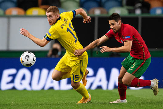 Dejan Kulusevski of Sweden and Raphael Guerreiro of Portugal