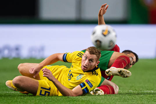 Dejan Kulusevski of Sweden and Raphael Guerreiro of Portugal