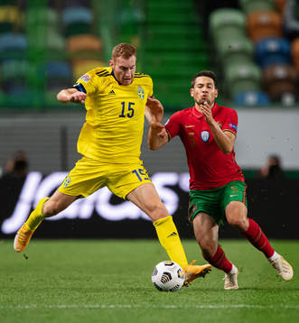 Dejan Kulusevski of Sweden and Raphael Guerreiro of Portugal