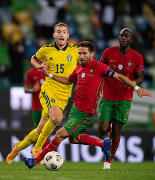 Dejan Kulusevski of Sweden in action against Joao Moutinho