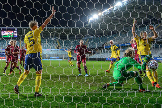 Nilla Fischer of Sweden celebrates the 5-0 goal by Pauline